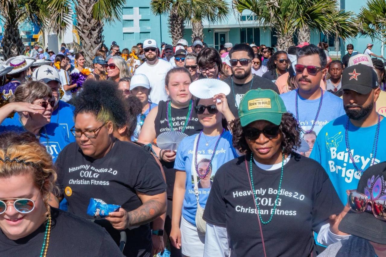 Walkers at the Out of the Darkness Walk wearing honor beads, walking together