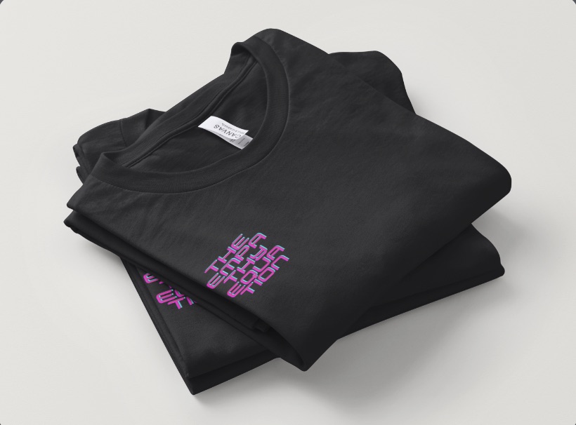 Two folded Empathy Equation team shirts showing the small front chest print.